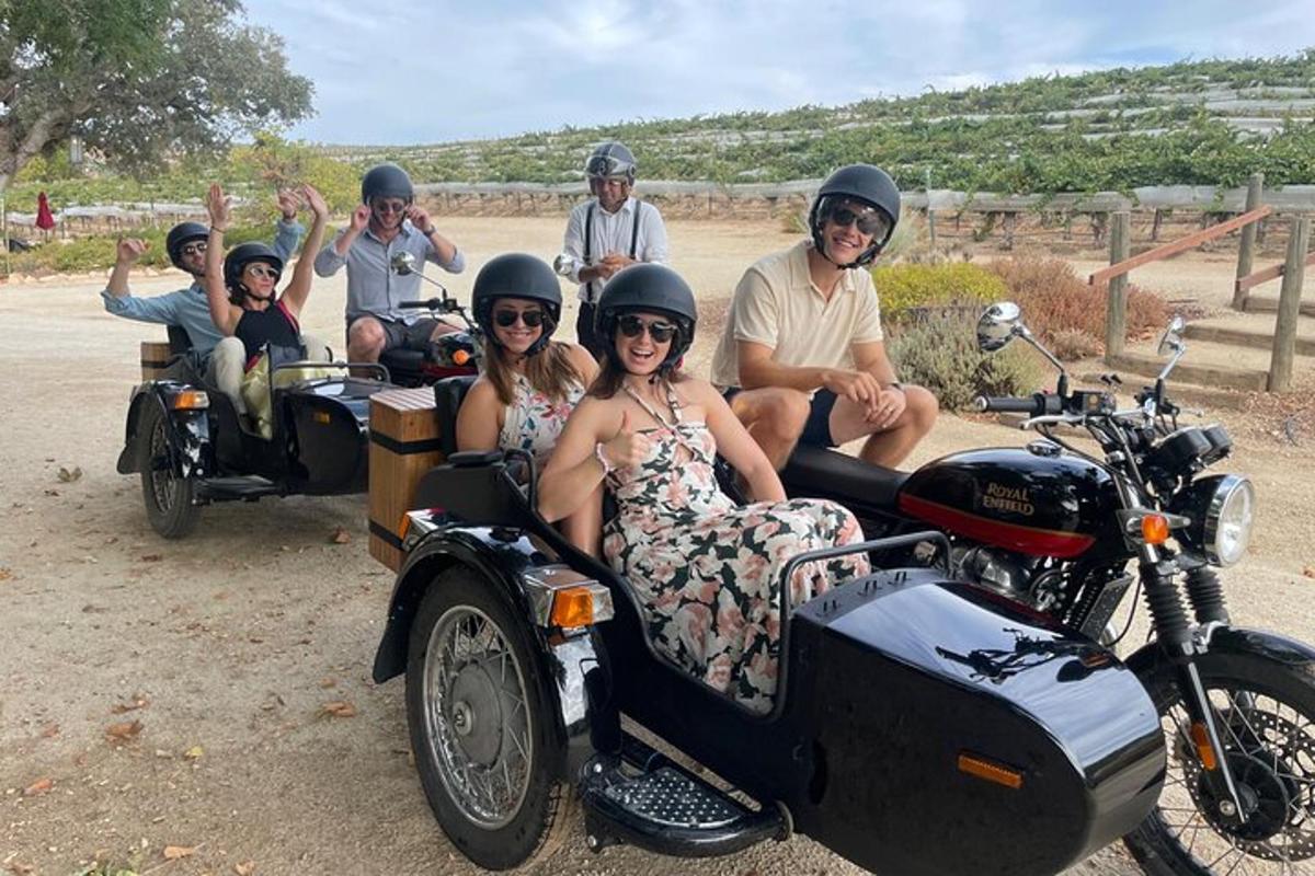 a group of people riding motorcycles with a side car