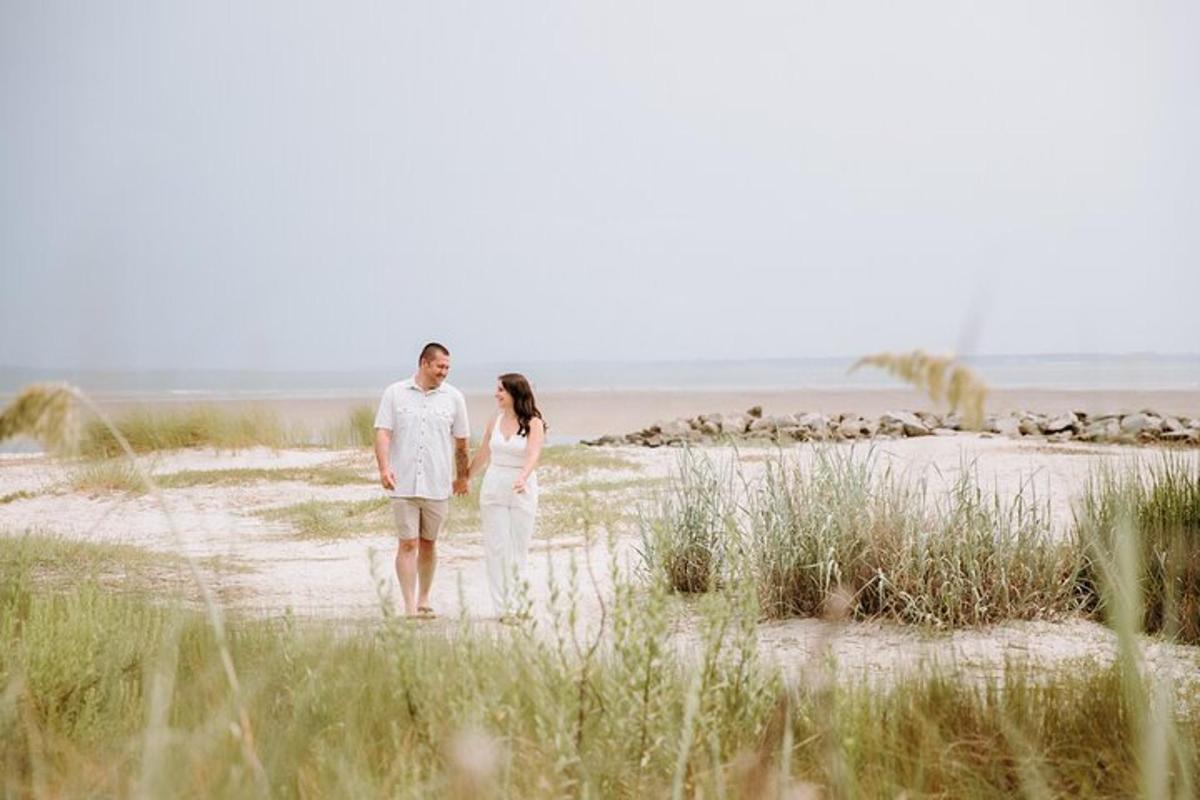 a man and a woman walking on the beach
