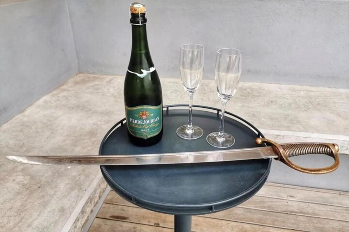 a bottle of wine on a table with two glasses
