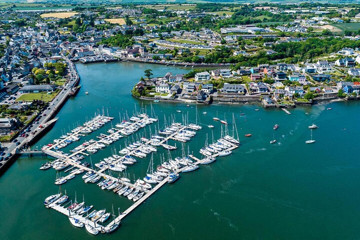 an aerial view of a harbor filled with boats