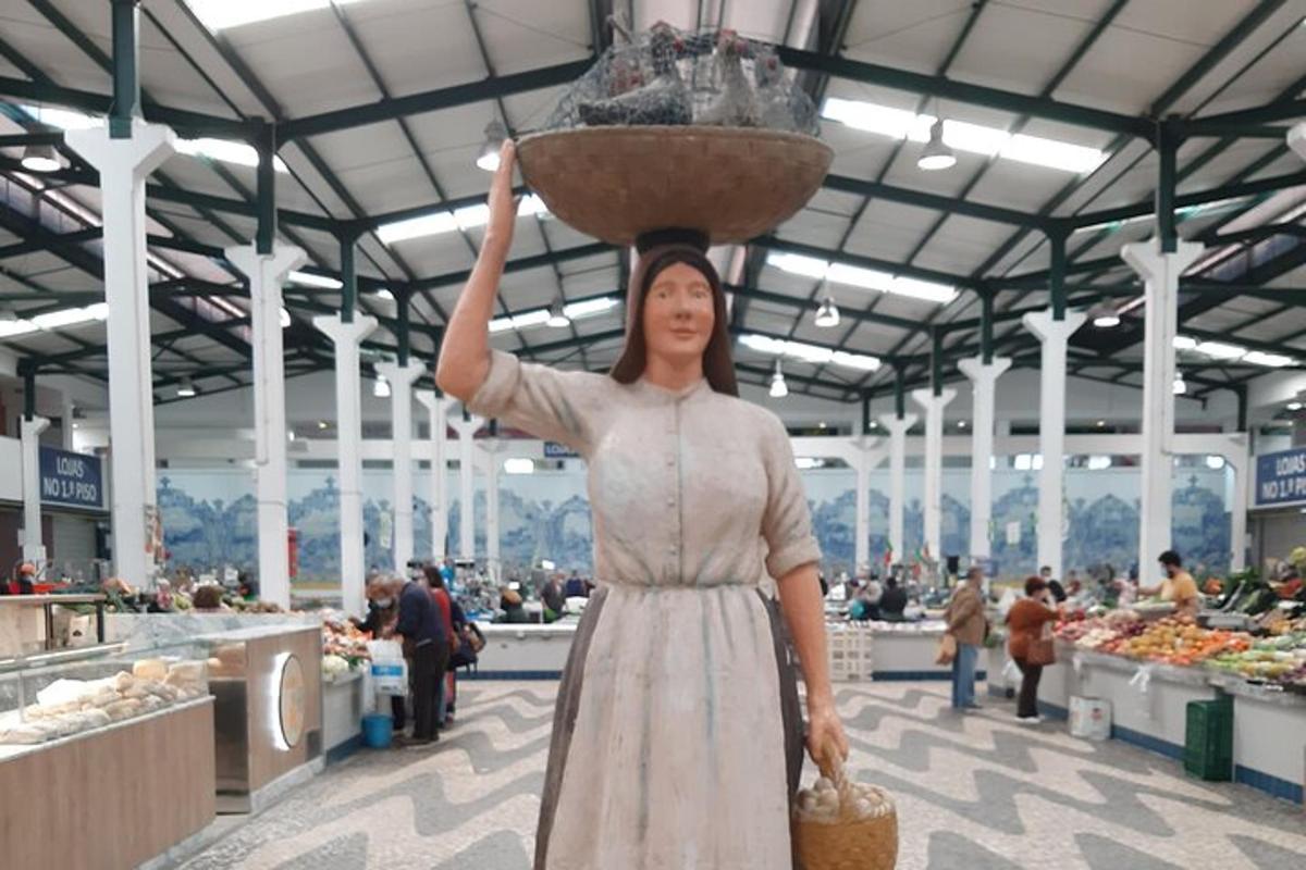 a woman holding a basket on her head in a market
