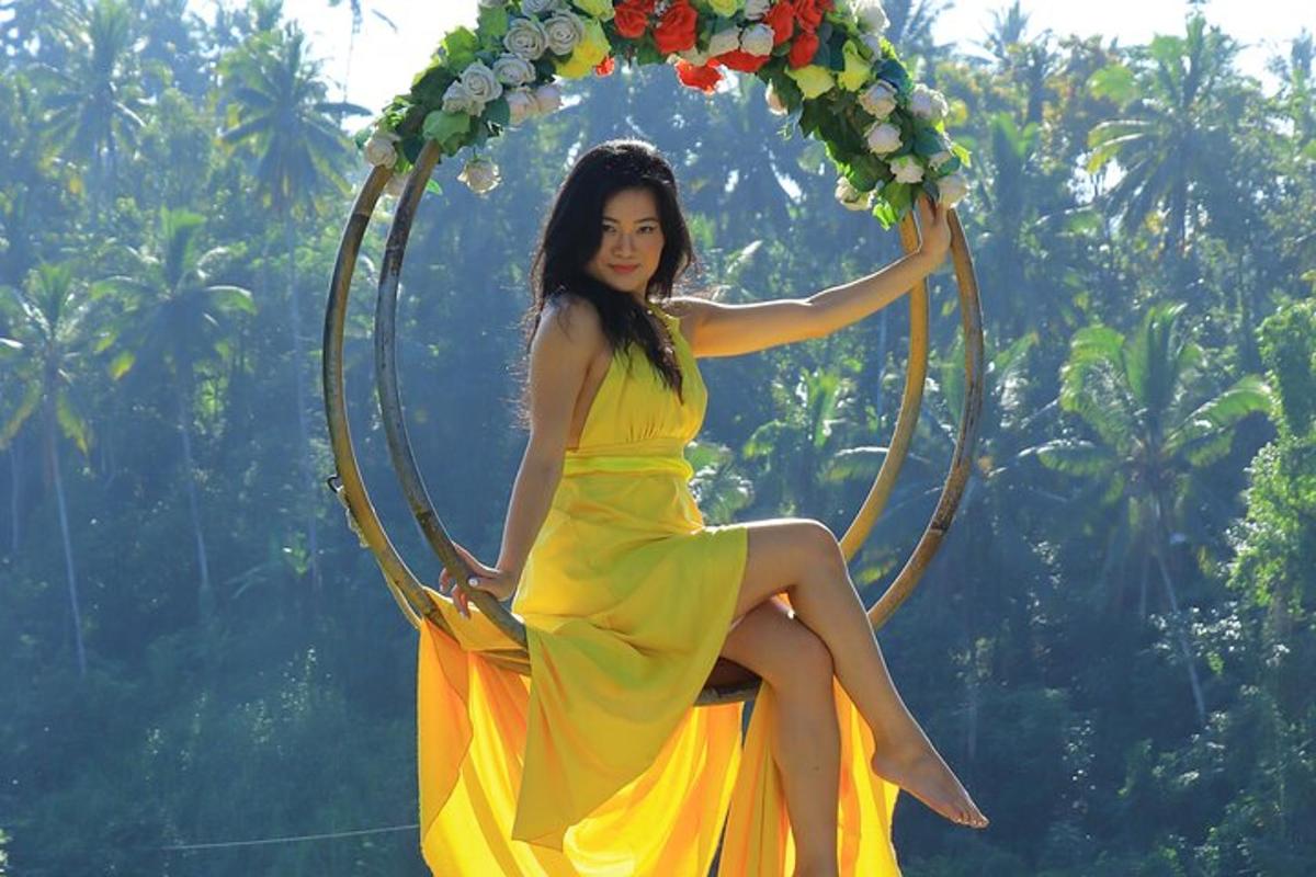a woman in a yellow dress sitting on a hoop