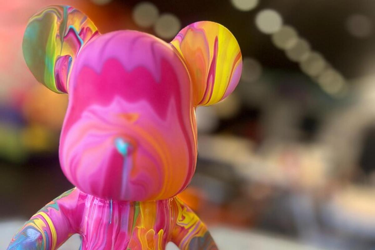 a pink teddy bear figurine is shown