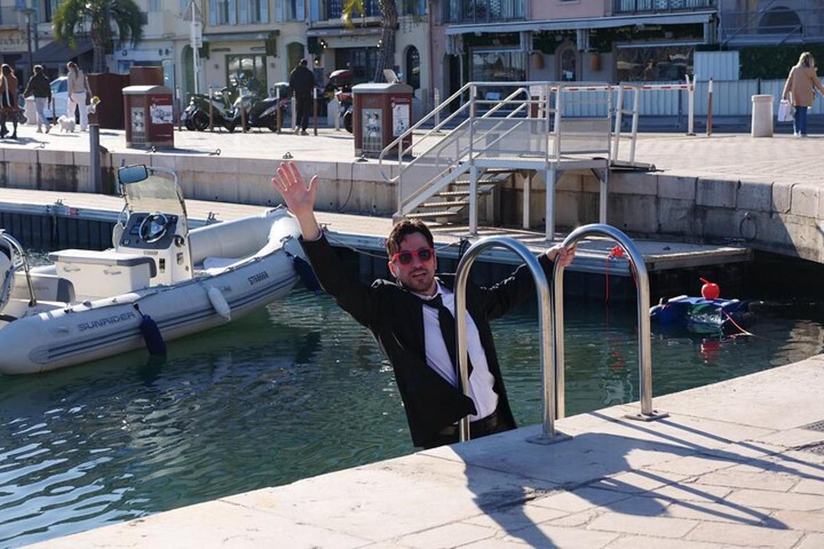 a man in a suit in the water next to a boat