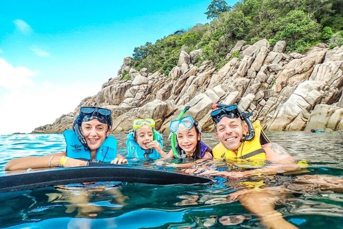 a group of people swimming in the water