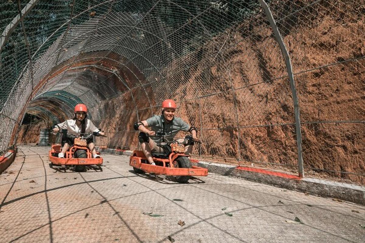 two men riding on toy motorcycles in a tunnel