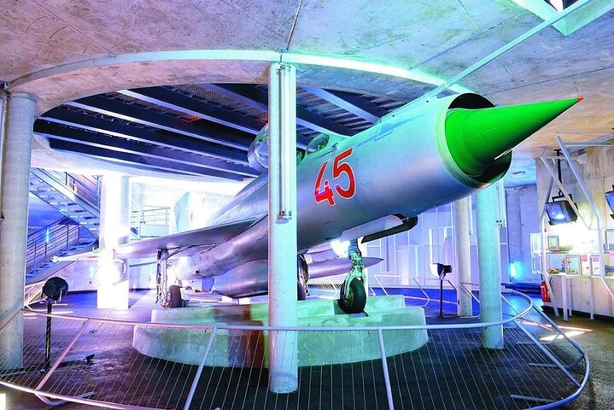 a fighter jet on display in a museum