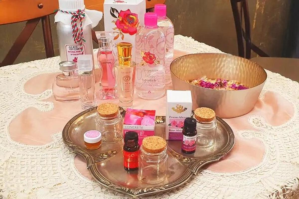 a table topped with a tray with bottles of perfume