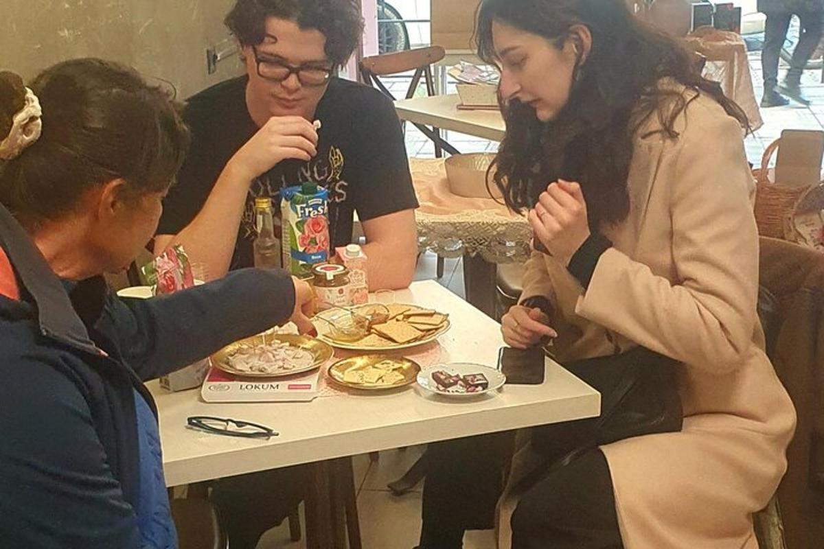 a group of people sitting around a table eating food