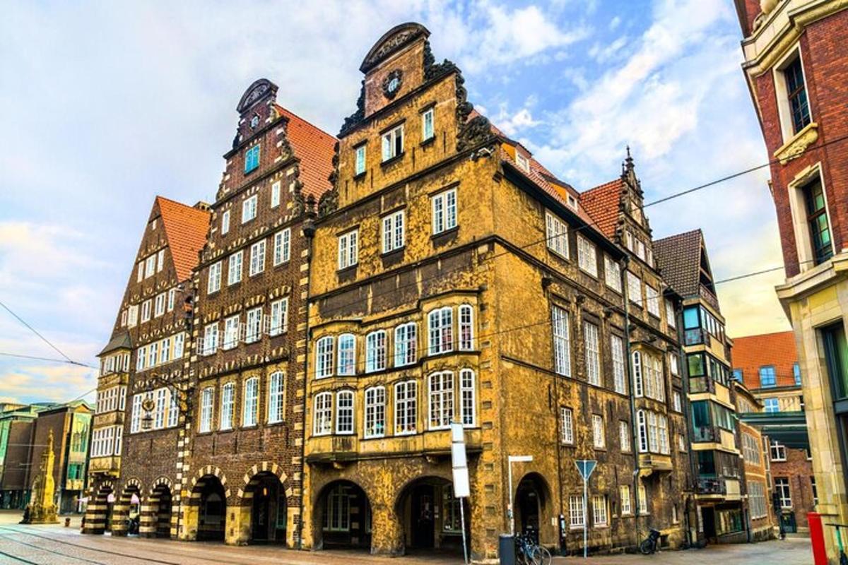 an old building with a clock tower on a street