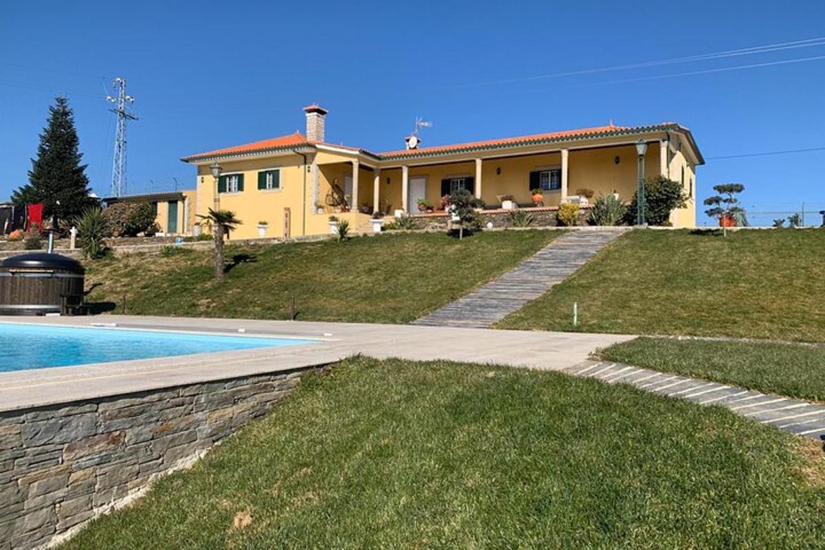 a house with a swimming pool in front of it