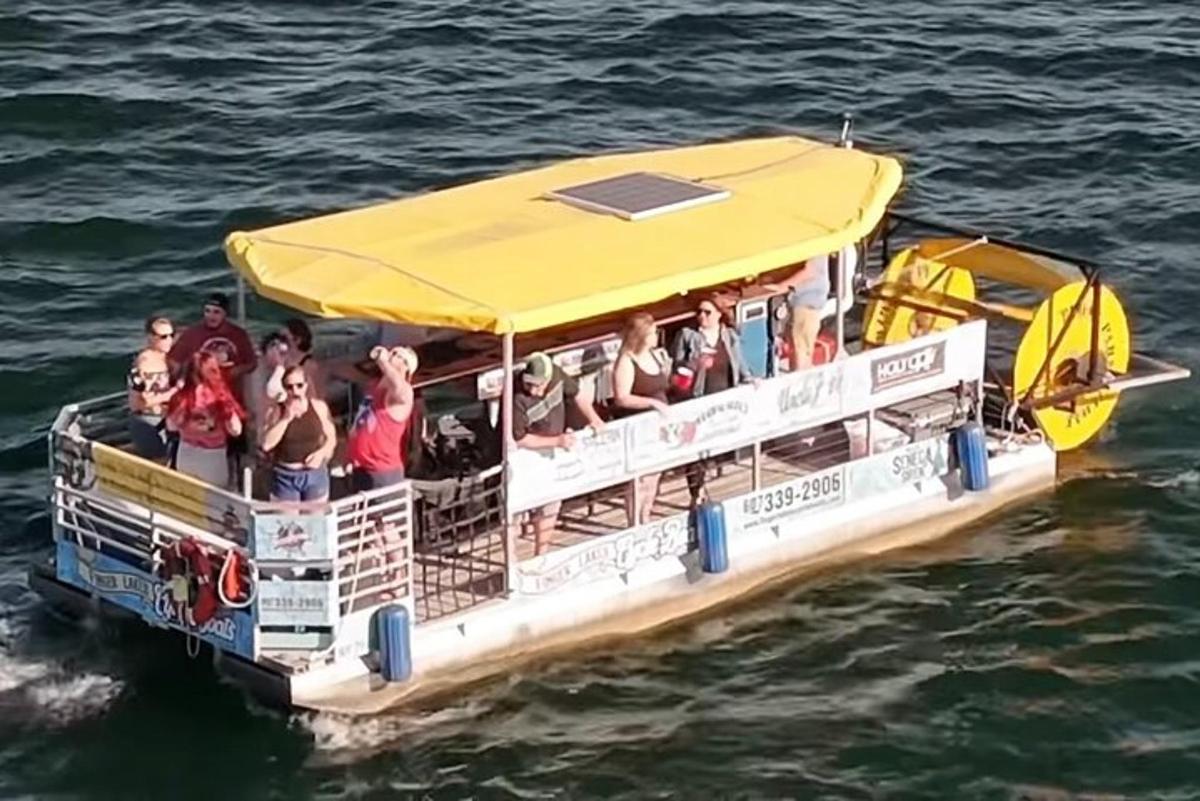 a group of people on a boat in the water