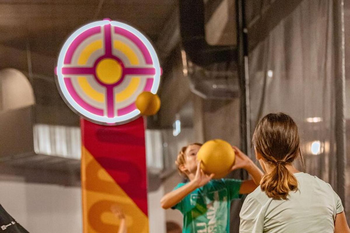 two women playing a game of basketball with balls