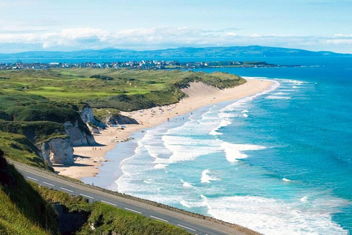 an aerial view of a beach next to the ocean