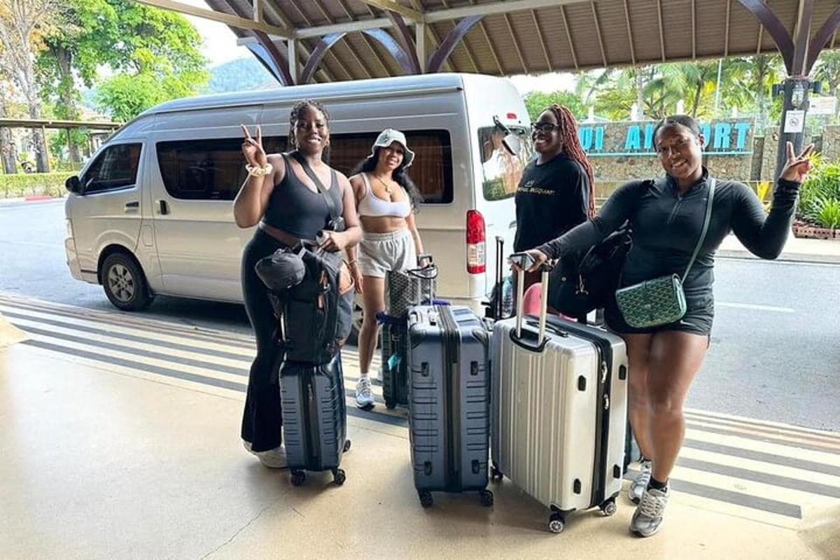 a group of people with luggage standing in front of a van