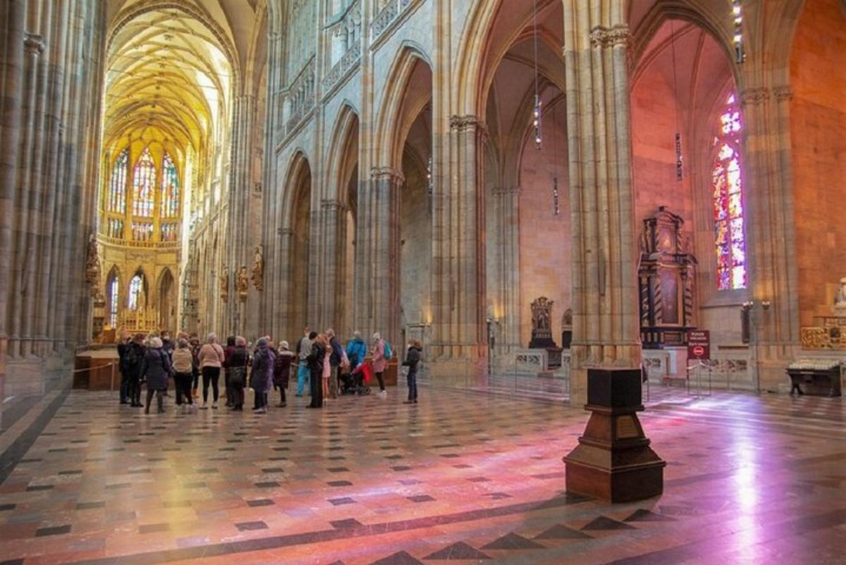 a group of people standing in a large cathedral