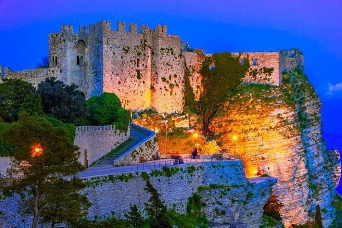 a castle on top of a mountain at night