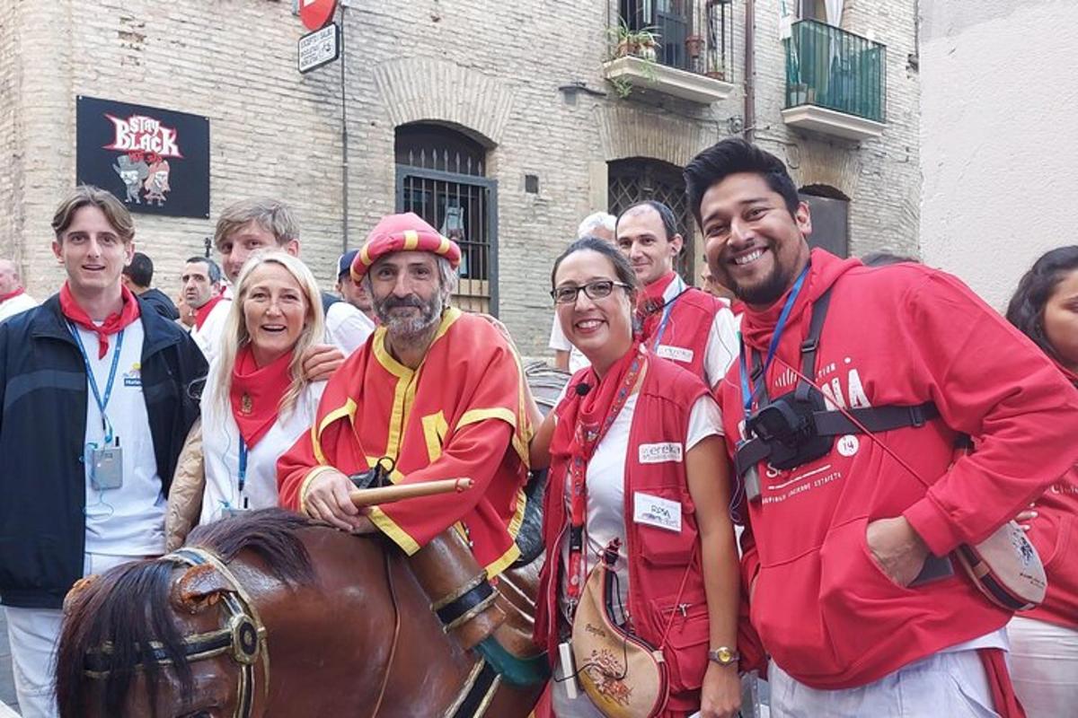 a group of people standing next to a horse