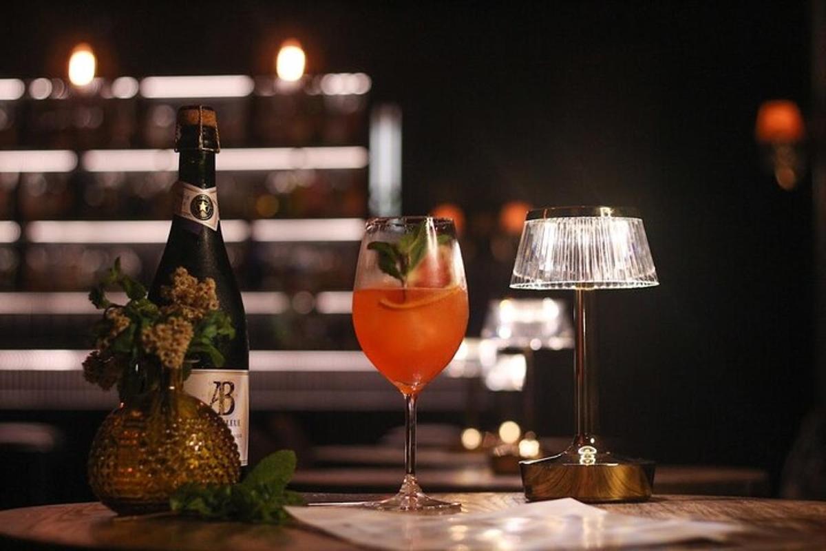 a bottle of champagne and a wine glass on a table