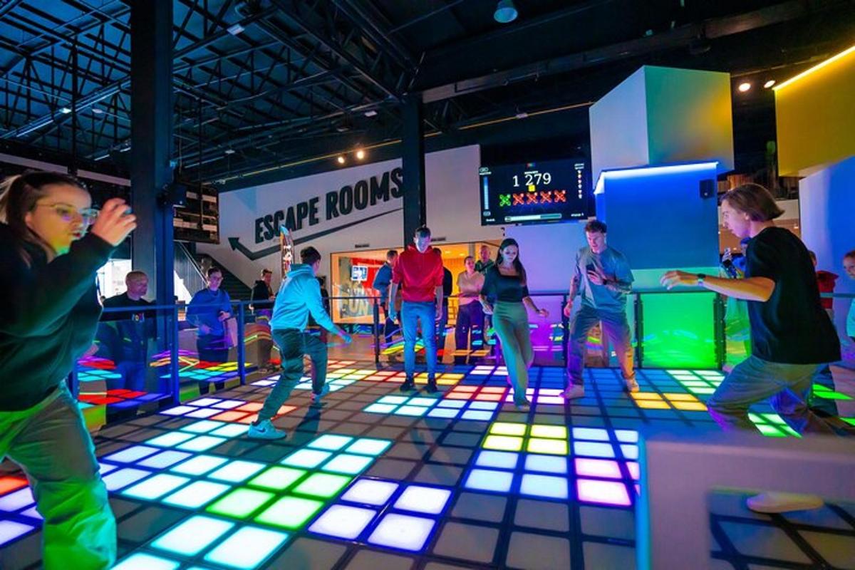a group of people dancing in a room with lights