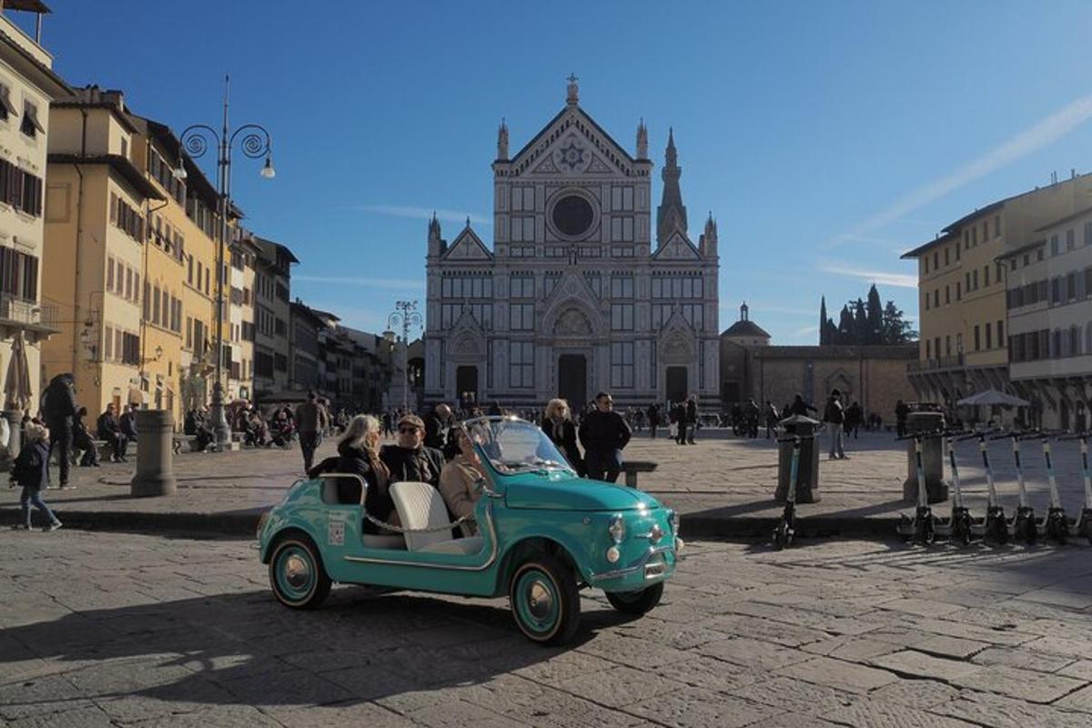 a group of people riding in an old car