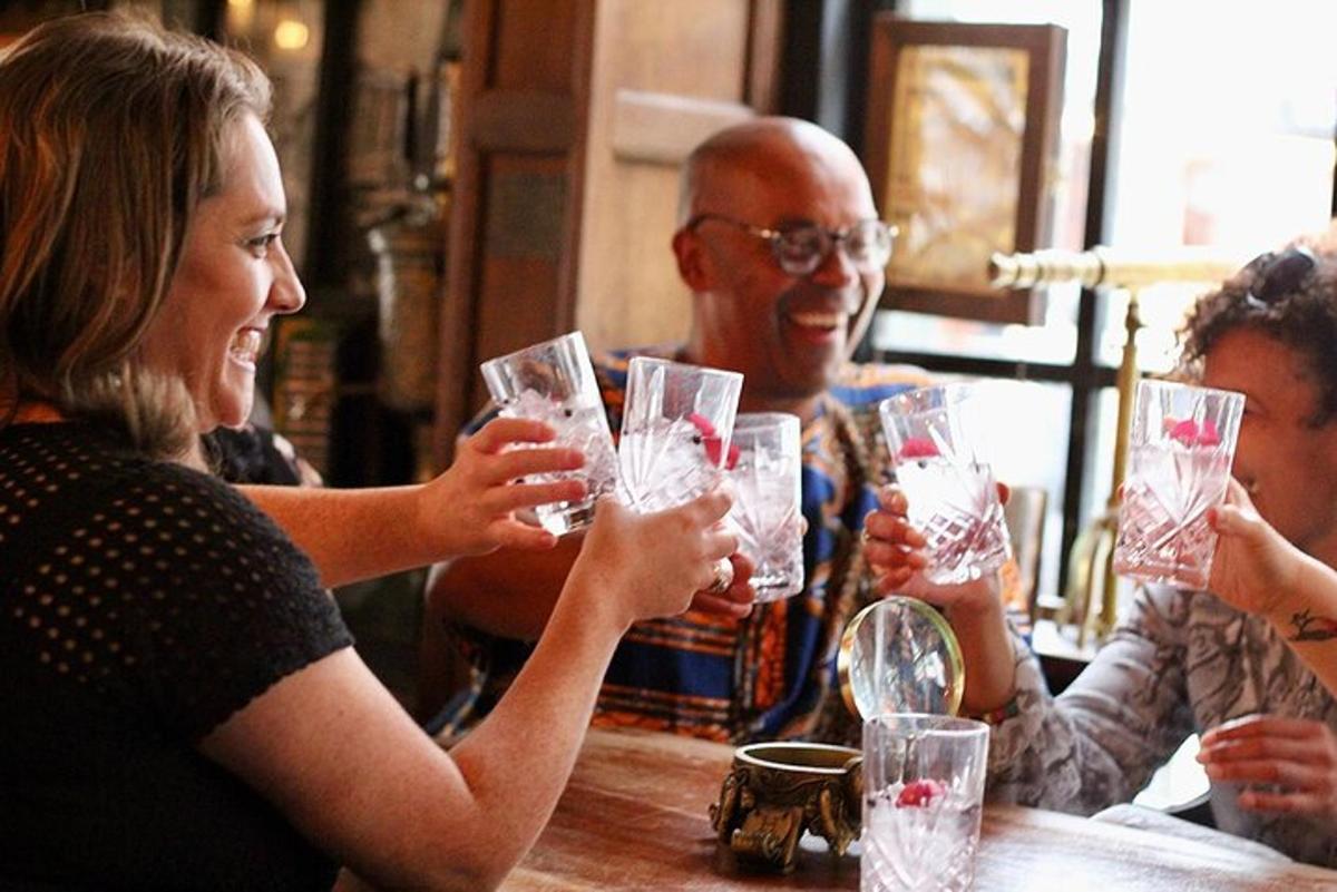 a group of people sitting at a table drinking wine glasses