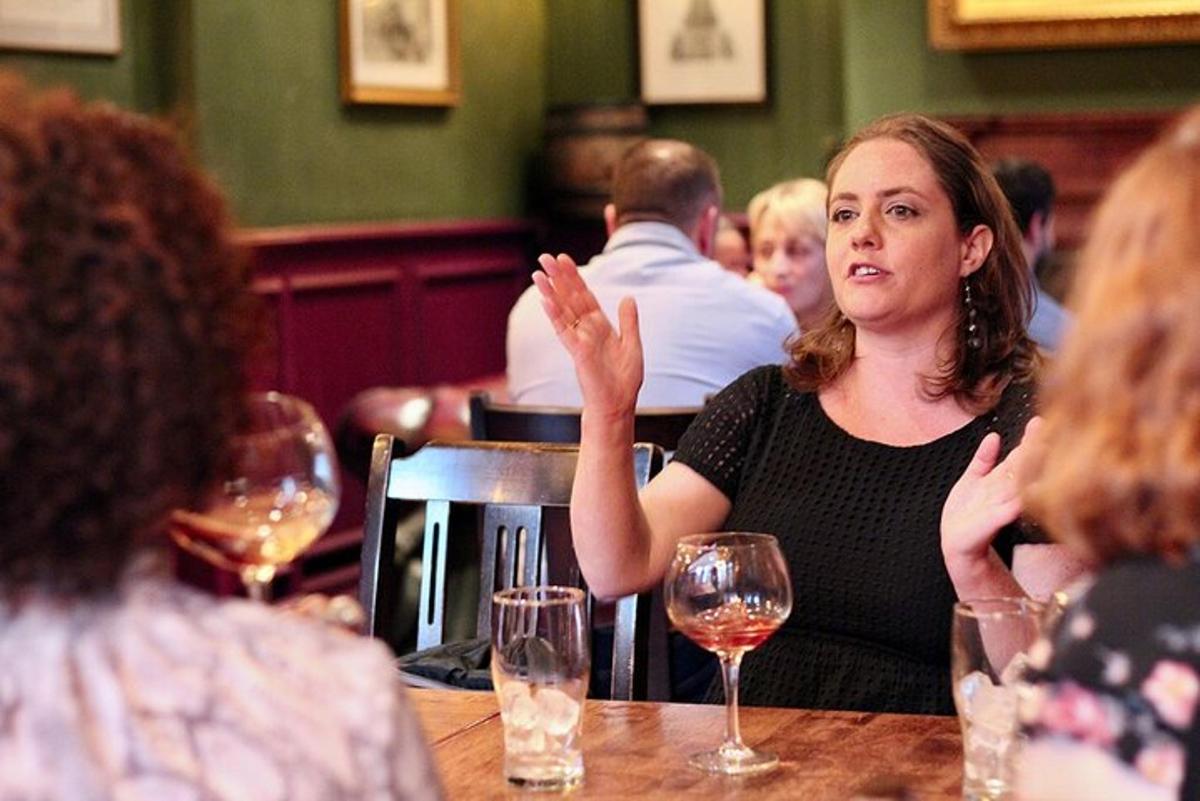 a woman sitting at a table in a restaurant