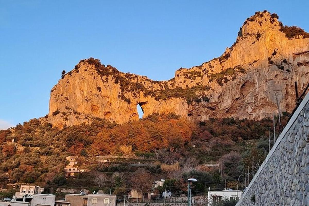 a large mountain with a town in front of it
