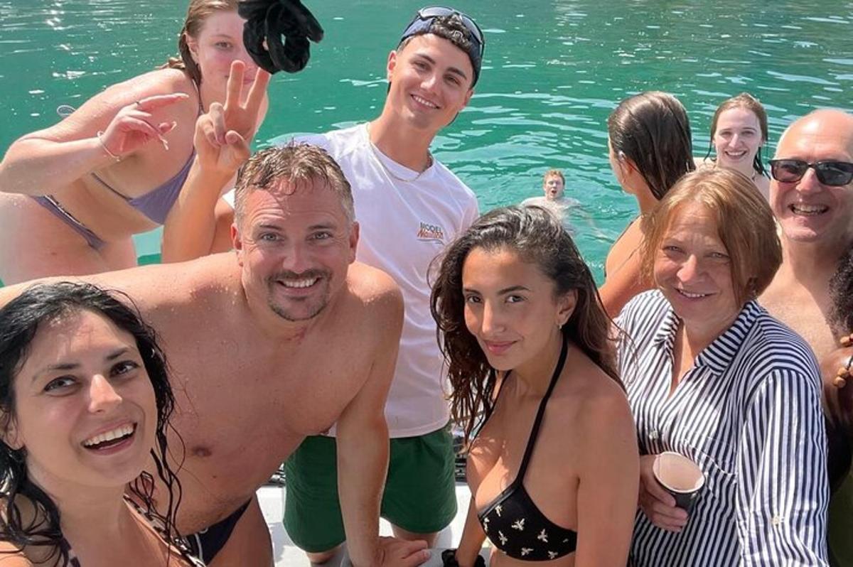 a group of people posing for a picture in the water