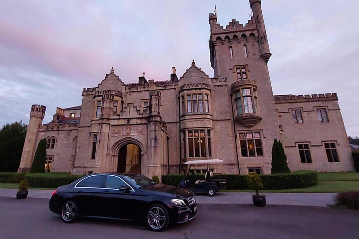 a black car parked in front of a building