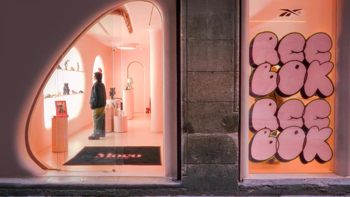 a person standing in a window of a store
