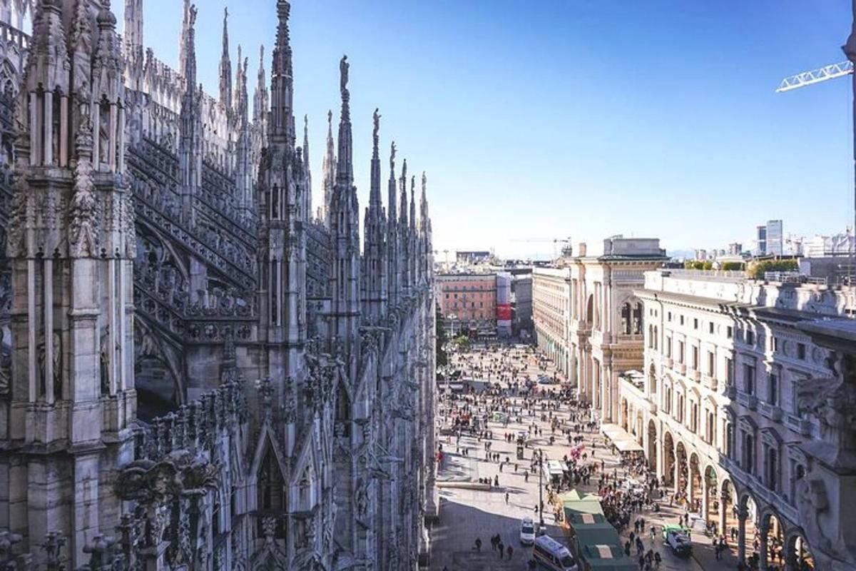 a large cathedral with a crowd of people on a city street