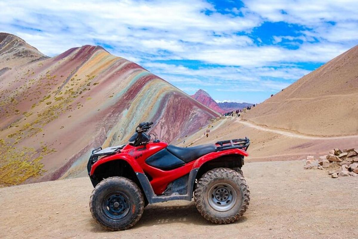 a red atv parked in the desert