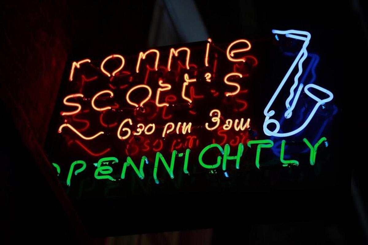 a neon sign that is lit up in the dark