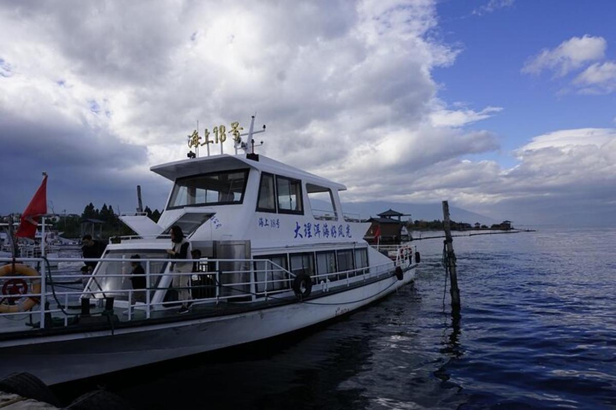 a boat is docked at a dock in the water