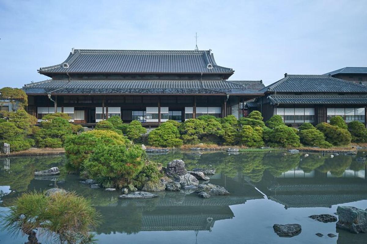 a building with a pond in front of a building