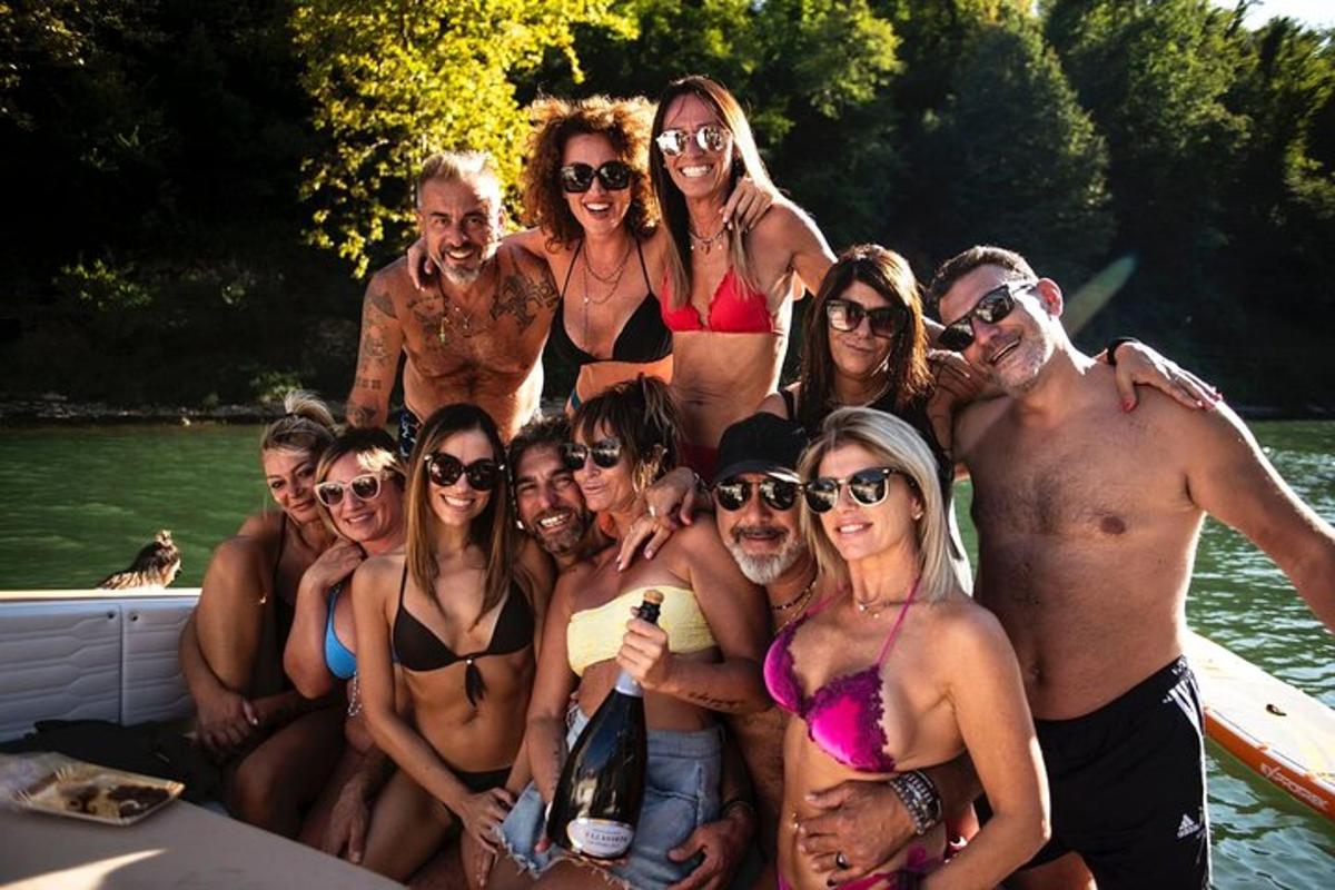 a group of people in bathing suits on a boat