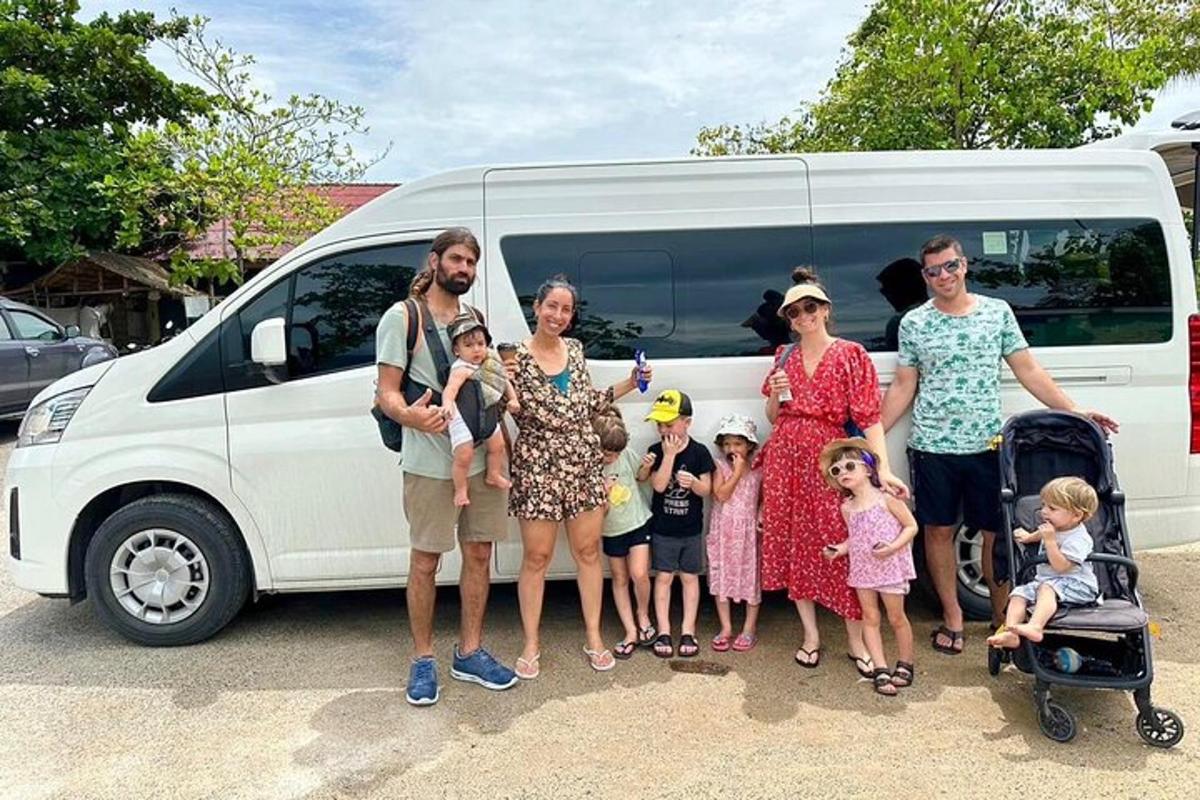 a group of people standing in front of a van