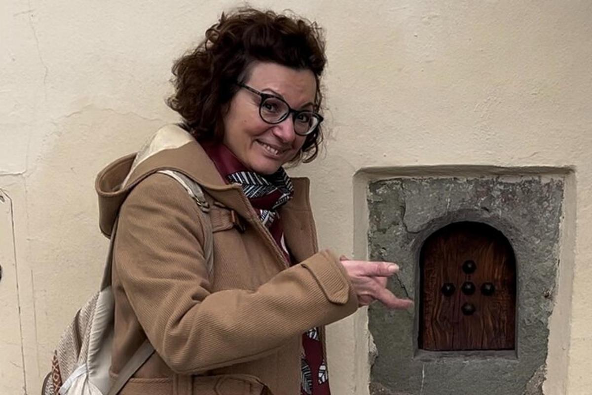 a woman standing in front of a door