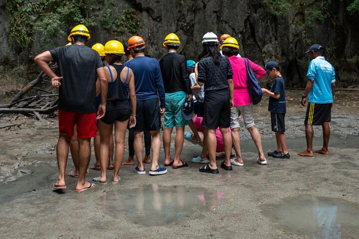 a group of people wearing hard hats standing together