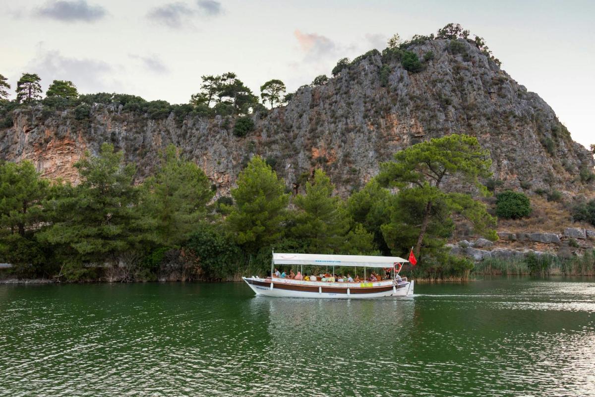 a boat with people on it in the water