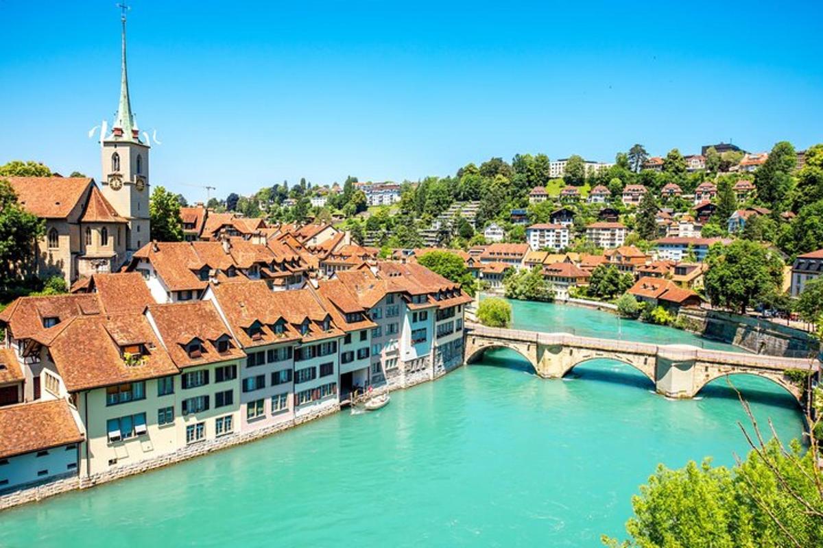 a city with a bridge over a river with buildings