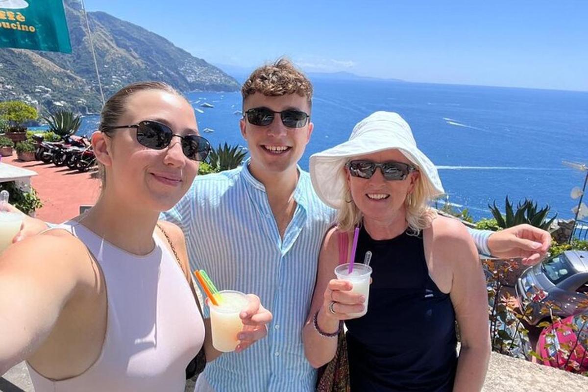 a group of three people posing for a picture