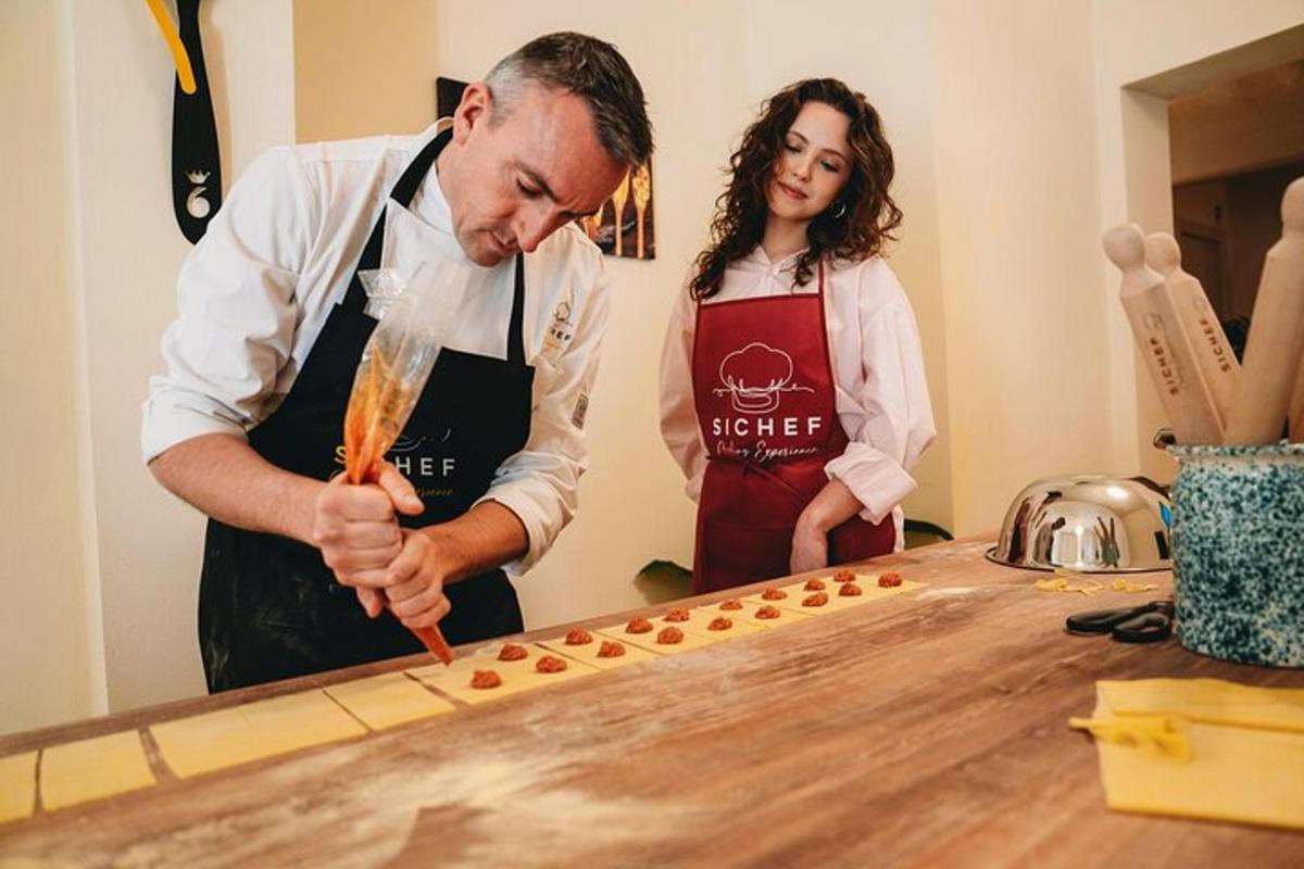 a man and woman in a kitchen preparing food