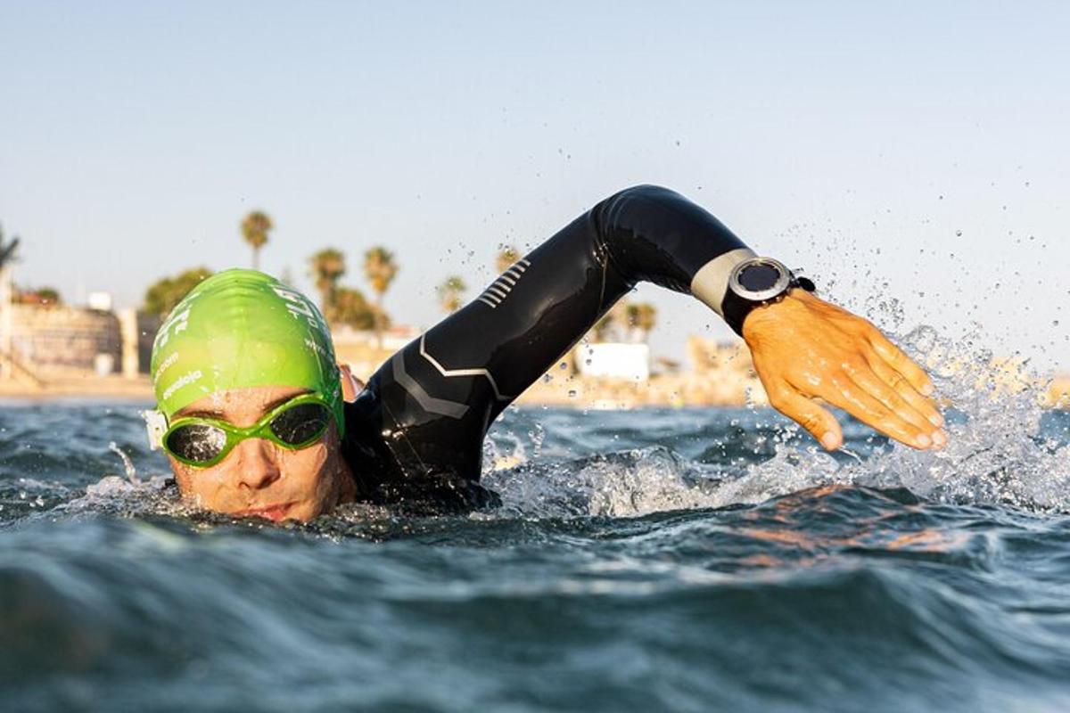 a person in a wetsuit in the water