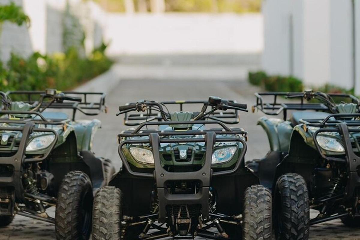 a group of four four wheelers parked next to each other