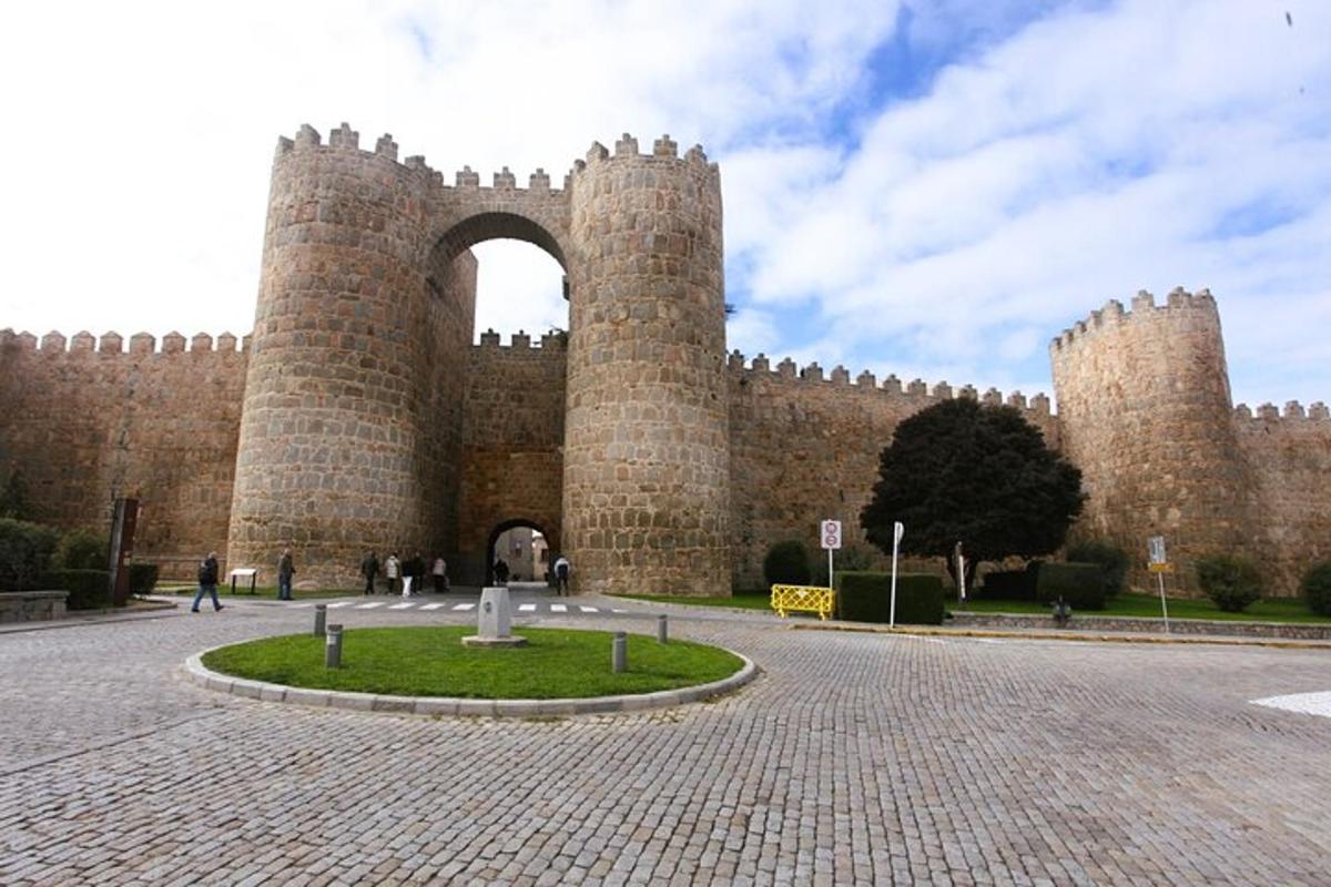 a large brick building with an arch in it