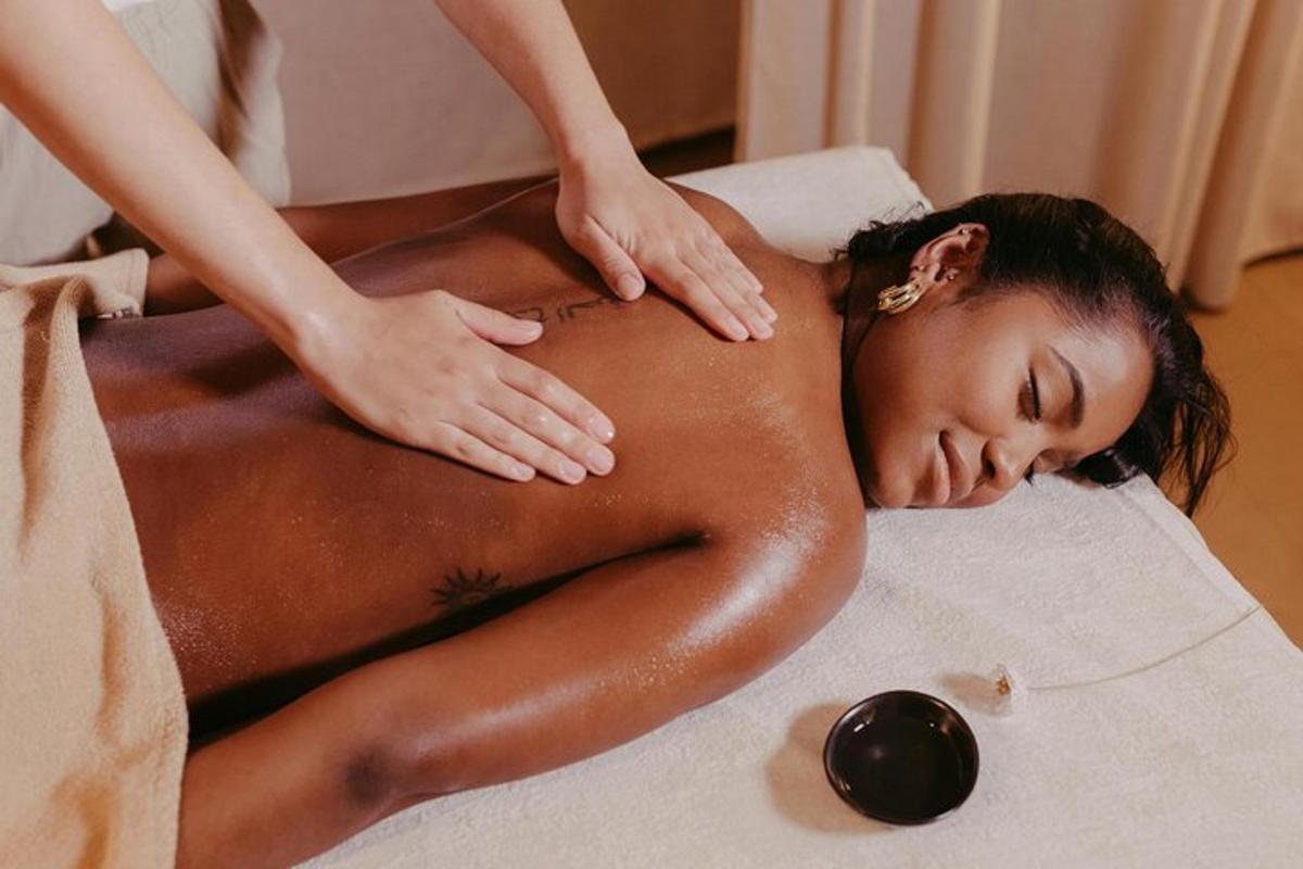 a woman is getting a massage in a spa