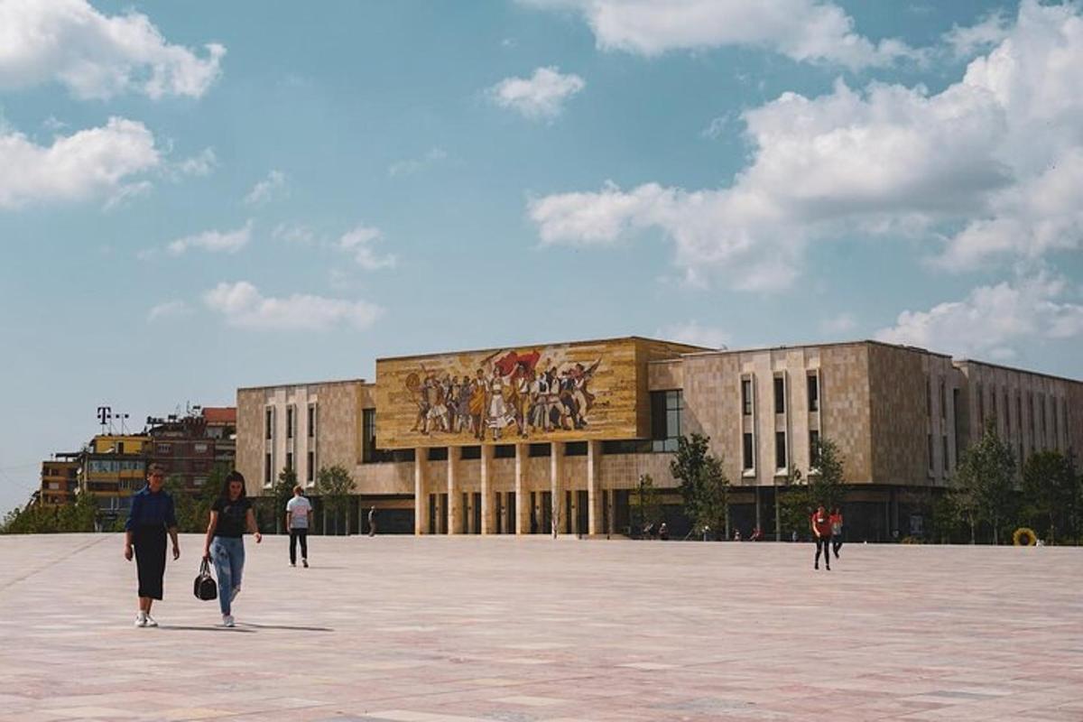 a group of people walking in front of a building