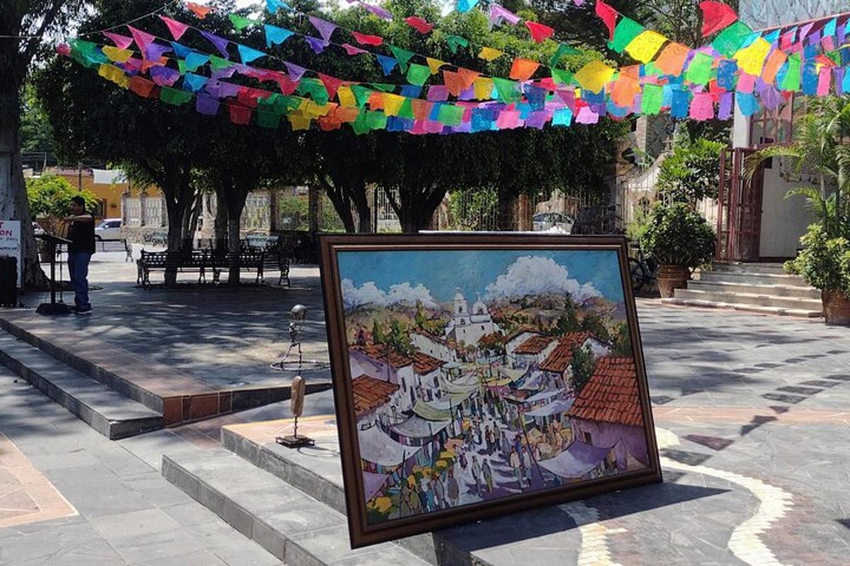uma pintura emoldurada em uma calçada com um colorido